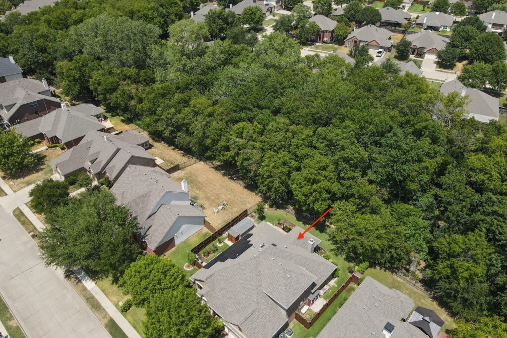 A view of houses and trees from above.